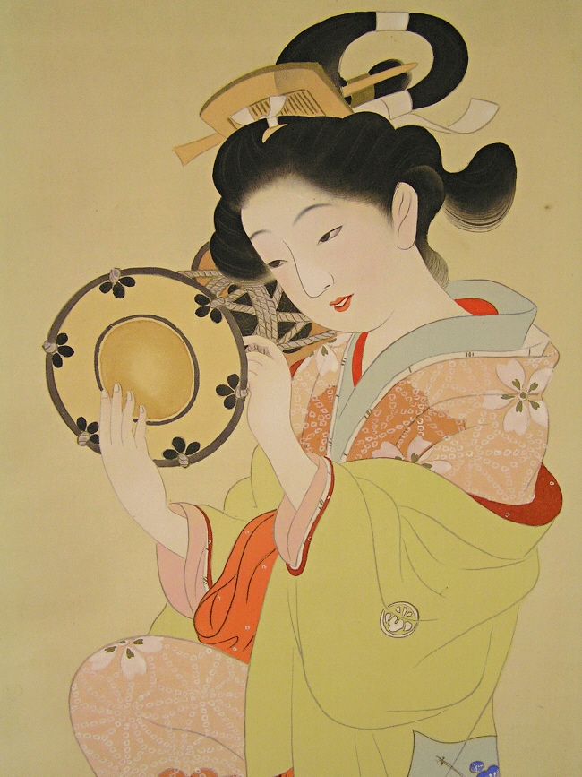 Playing Japanese traditional instrument Tsuzumi